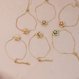 Adjustable gold flower bracelets featuring colorful zircon petals and rotating floral charm