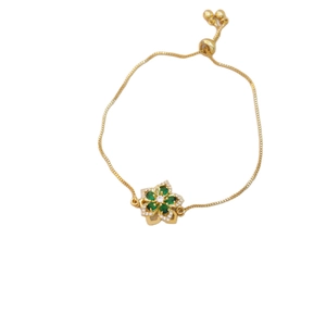 Adjustable gold-plated box chain bracelet with a green flower charm and cubic zirconia