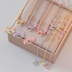 Bijoux Collier Bracelet Et Bague Ouverte Noeud Coeur Zircon Rose Acier Titane Cuivre Mode Femmes Doux Élégant