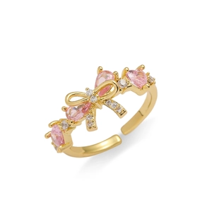 Bague ajustable dorée avec nœud papillon et zircons roses en forme de goutte