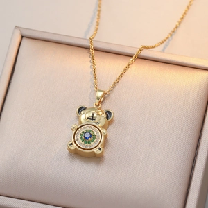 Golden bear pendant necklace with blue and green gemstones and crystal halo