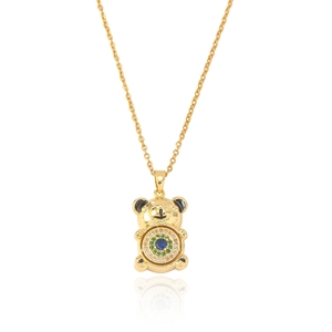 Detail of bear pendant with blue zircon center and golden chain on white background