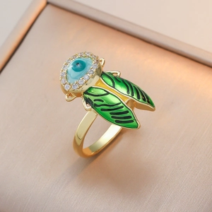 Creative Cicada open ring with green enamel wings and Evil Eye rhinestone detail