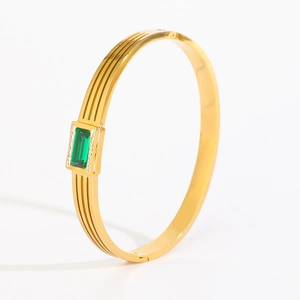 Gold-plated titanium steel bracelet featuring rectangular emerald stone and micro-diamonds