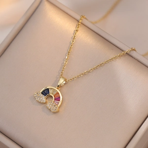 Golden rainbow cloud necklace with colorful zircons on champagne jewelry box