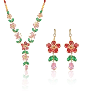 Elegant emerald and zircon floral jewelry set with necklace and matching earrings