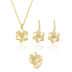 Rotating floral jewelry set with blue enamel petals and zircon pendant, earrings and ring