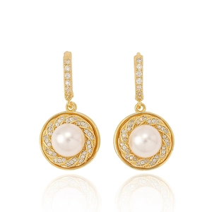 Detail of vintage gold pearl earrings with a spiral zircon frame and horse buckle clasp