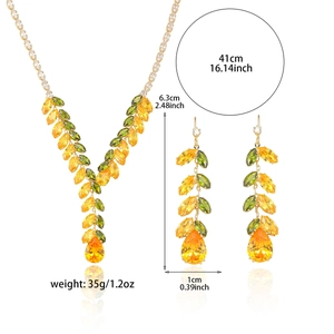 Elegant gold-tone zircon jewelry set with yellow and green gemstones in wheat ear design