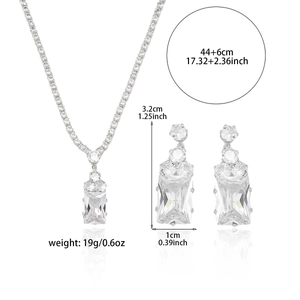 Silver tone jewelry set with emerald-cut cubic zirconia necklace and stud earrings