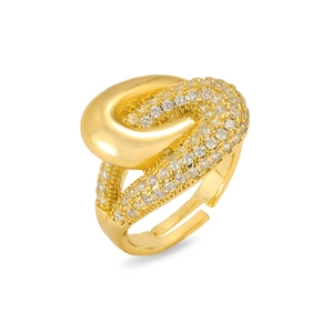 Detail of adjustable gold ring featuring polished curves and sparkling pavé zircon setting