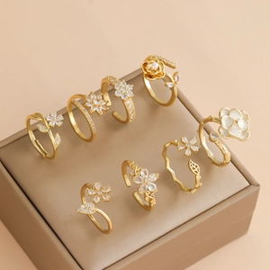 French style gold flower open rings set with zircon and pearl in a jewelry box