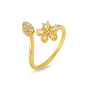 Detailed macro shot of an adjustable gold-plated ring with crystal flower and leaf motifs