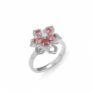 Macro view of rotating floral necklace with red pear-cut stones and white zircon accents