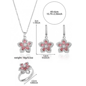 Detailed view of rotating zircon flower necklace, earrings, and ring set with dimensions