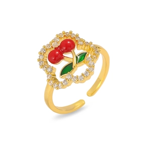 Adjustable gold ring featuring red cherry design with green enamel and sparkling rhinestones