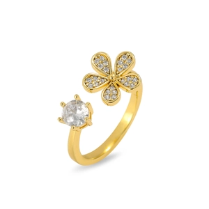 Detail of adjustable gold floral ring with micro-pave petals and a large round zircon