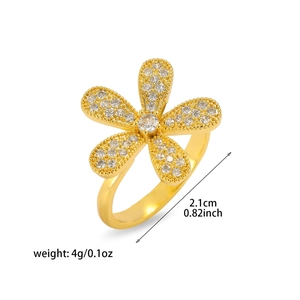 Detail of floral gold ring with clear gemstones showing size 2.1cm and 4g weight specs