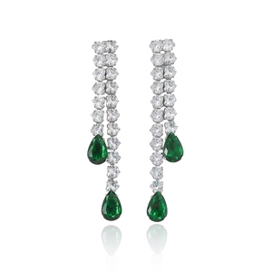 Silver drop earrings with green pear-shaped stones and white zircons on white background