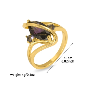 Detail view of gold floral ring with purple marquise stone showing 2.1cm diameter size