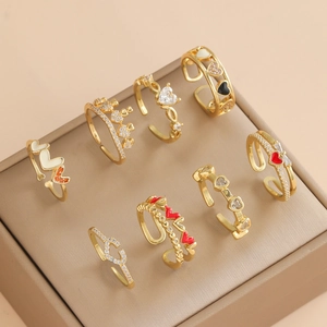 8-piece set of gold adjustable open rings for women featuring heart and crown designs