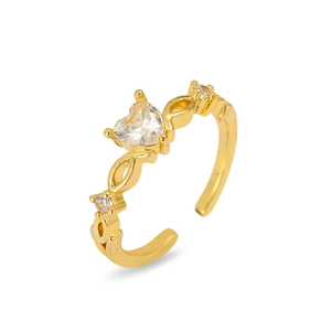 Detail of adjustable gold ring with heart-shaped zircon and side diamond accents