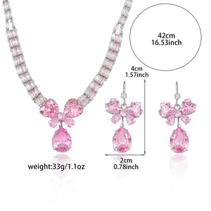 Pink zircon butterfly jewelry set with necklace and earrings on white background