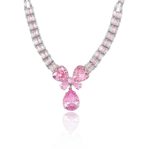 Luxury silver necklace with pink zircon bow and pear-shaped gemstone on white background