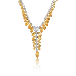 Silver necklace with yellow wheat ear zircon pendants and a heart shaped crystal