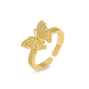 Macro view of gold butterfly ring featuring intricate hollow wings and micro-pave crystals