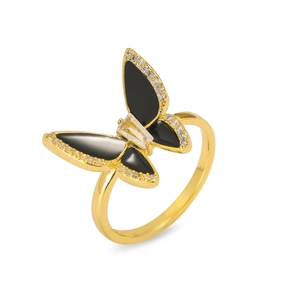 Detailed close-up of a butterfly ring with black wings, gold plating, and small crystals