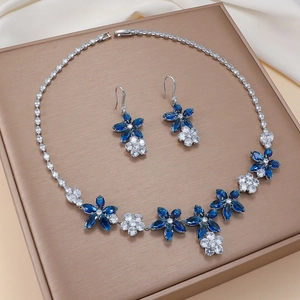 Elegant silver sunflower jewelry set with blue marquise gemstones and white zircons
