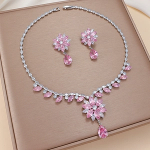 Elegant silver necklace and earrings set with pink flower zircon and teardrop pendants
