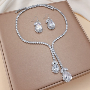 Elegant zircon tulip jewelry set with necklace and drop earrings on champagne silk