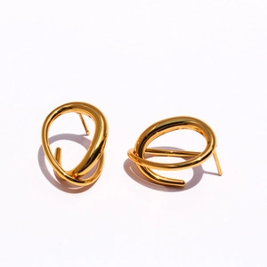 Minimalist gold plated brass earrings featuring a unique twisted geometric circle design