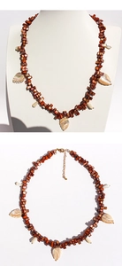 Detailed view of bohemian beaded necklace with carved mother-of-pearl leaf pendants