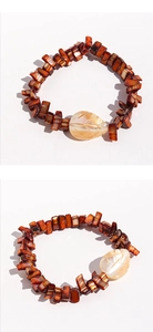 Detailed view of handmade beaded bracelet featuring shell leaves and reddish brown tiles