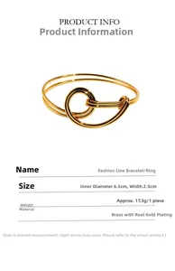 Detail of gold linear bangle showing 6.5cm inner diameter and 2.5cm width dimensions