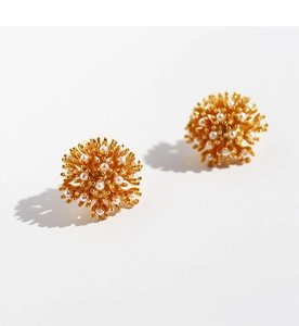 Detailed view of French vintage gold firework earrings with clusters of micro pearls