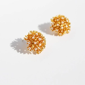 French vintage fireworks cluster earrings with golden stems and white pearls on white base