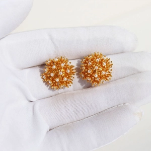 French vintage style firework pearl stud earrings in gold sunburst floral design