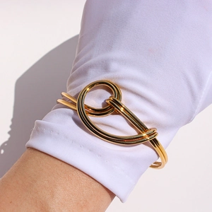 Golden double-layered knot cuff bracelet with a minimalist minimalist open-ended design