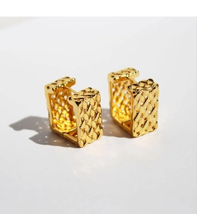 Detail of gold woven mesh texture on wide rectangular hoop earrings for women