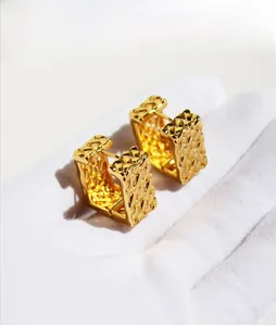 Detail presentation of gold-tone woven mesh rectangular hoop earrings for women