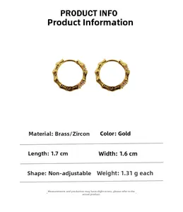 Bamboo style gold hoop earring with zircons and product dimensions of 1.7cm by 1.6cm
