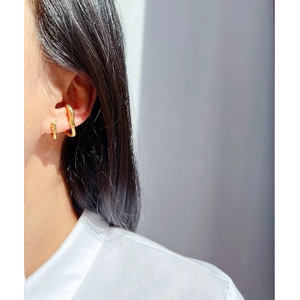 Golden irregular texture ear cuff and earring set on model with minimalist style