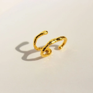 Modern double-layered gold ear cuff featuring a unique hammered metal texture finish