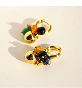 Detail of gold hoop earrings featuring multi-colored agate and polished golden beads