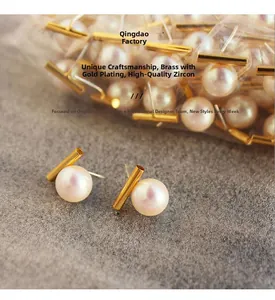 Detailed macro view of gold-plated brass earring with premium pearl and zircon
