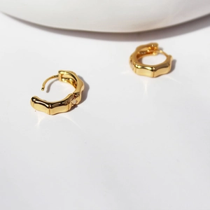 Bamboo style gold plated hoop earrings with zircon inlay for a minimalist look